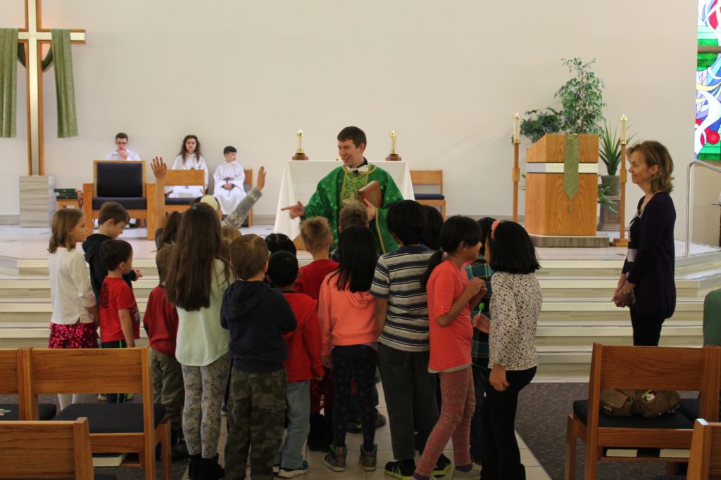 Children gathered at the front of the church during Children